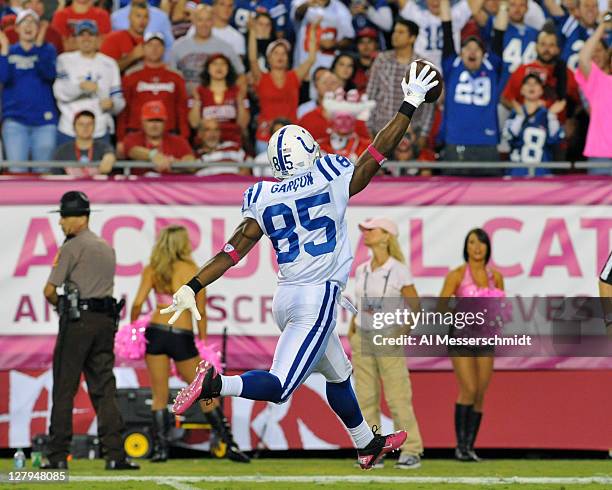 Wide receiver Pierre Garcon of the Indianapolis Colts runs to the end zone with a touchdown pass against the Tampa Bay Buccaneers October 3, 2011 at...