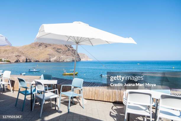 restaurant terrace by the sea - almeria restaurant stock-fotos und bilder