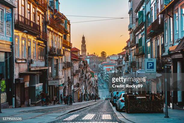 rue de 31 de janeiro with the clérigos church in porto at sunset - porto portugal stock pictures, royalty-free photos & images