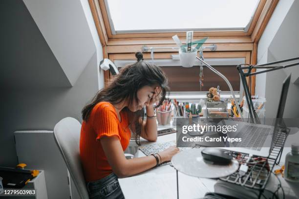 stressed hispanic student during home schooling pandemic alert - online bullying foto e immagini stock