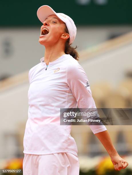Iga Swiatek of Poland celebrates after winning championship point during her Women's Singles Final against Sofia Kenin of The United States of...
