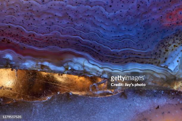 luxury raw purple agate crystal surface texture as a background. natural pattern surface, abstract design element of mineral stone macro closeup. - gioielli foto e immagini stock