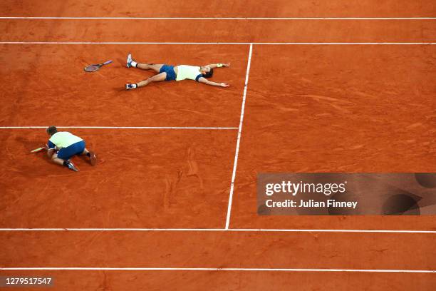 Kevin Krawietz and Andreas Mies of Germany celebrate after winning championship point in their Men's Doubles Final on Court Philippe-Chatrier against...