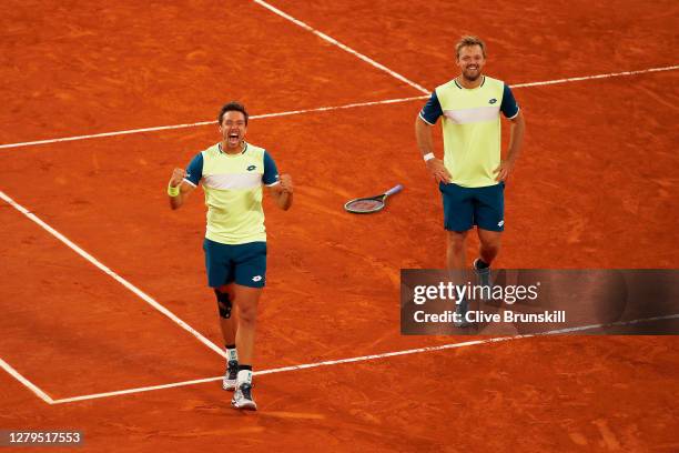 Kevin Krawietz and Andreas Mies of Germany celebrate after winning championship point in their Men's Doubles Final on Court Philippe-Chatrier against...