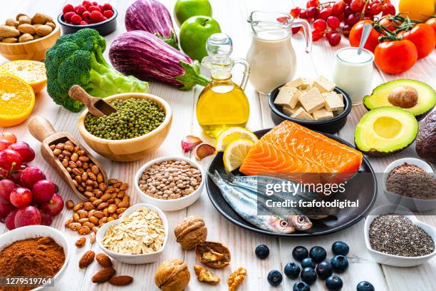 healthy foods to lower cholesterol and heart care - ldl cholesterol stock pictures, royalty-free photos & images