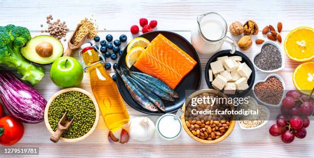 foods to lower cholesterol shot on white table - soya milk stock pictures, royalty-free photos & images