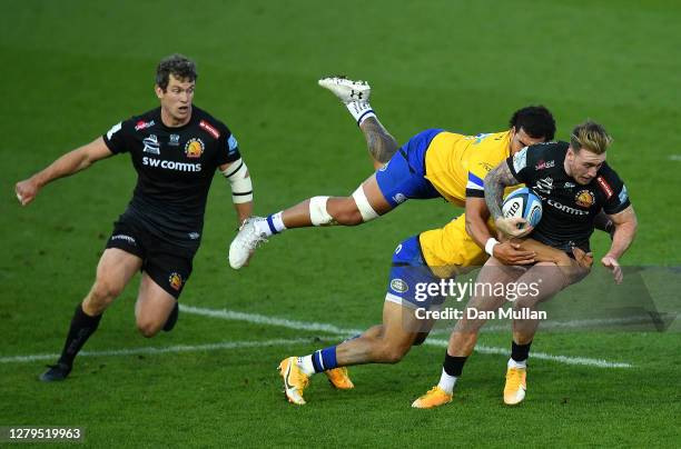 Stuart Hogg of Exeter Chiefs is tackled by Jonathan Joseph and Josh Matavesi of Bath during the Gallagher Premiership Rugby first semi-final match...