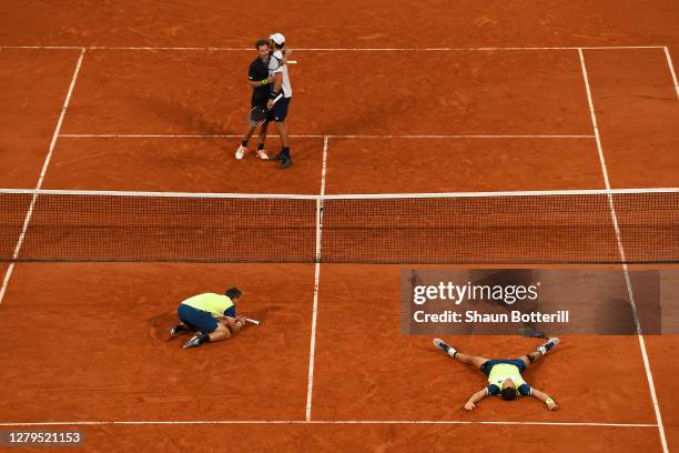 Kevin Krawietz and Andreas Mies of Germany celebrate after winning championship point in their Men's Doubles Final on Court Philippe-Chatrier against...