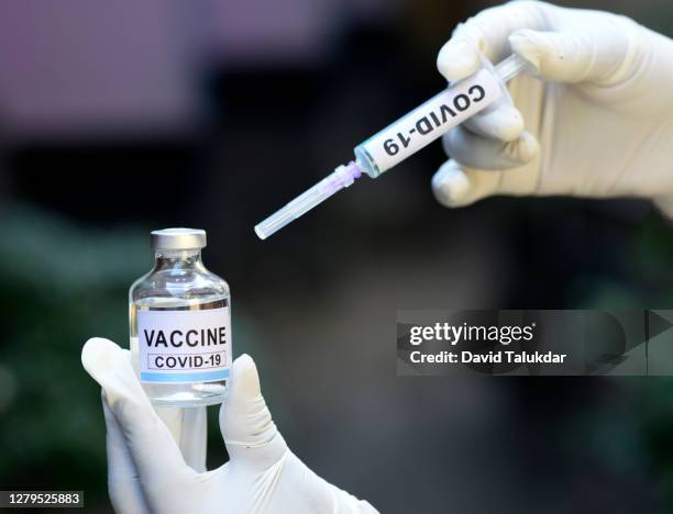 a bottle of  covid-19 vaccine - india covid stock pictures, royalty-free photos & images