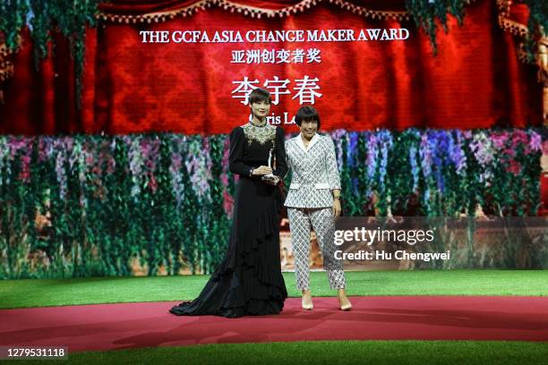 Li Yuchun and Angelica Cheung onstage at the Green Carpet Fashion Awards at Shanghai Tower on October 10, 2020 in Shanghai, China.