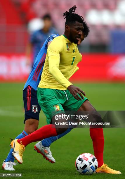 Gaku Shibasaki of Japan battles for the ball with Andre Frank Zambo Anguissa of Cameroon during the international friendly match between Japan and...