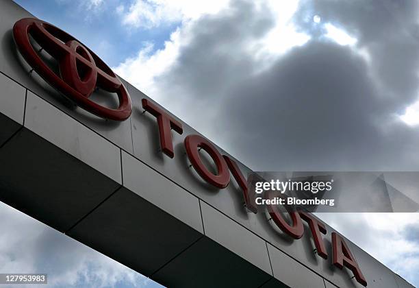 The Toyota Motor Corp. Logo is displayed outside the Toyota Central Motors dealership in Karachi, Pakistan, on Monday, Oct. 3, 2011. Indus Motor Co.,...