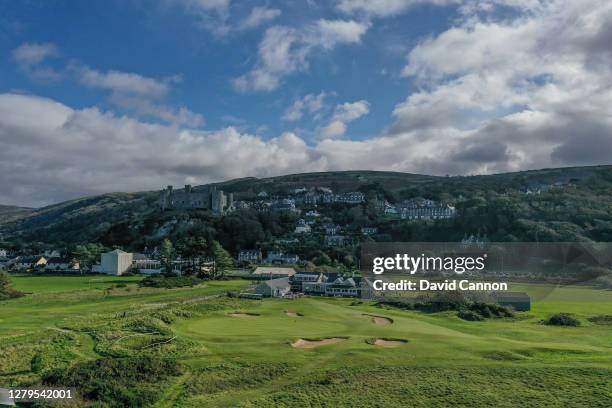 An aerial view of the par 3, 18th hole and clubhouse with Harlech Castle on the hill behind at Royal St Davids Golf Club on October 07, 2020 in...