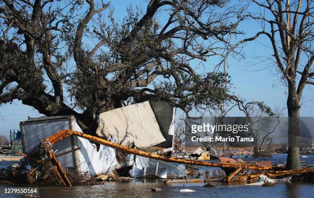 Flood waters surround structures destroyed by Hurricane Laura on October 10, 2020 in Creole, Louisiana. Hurricane Delta made landfall near Creole as...