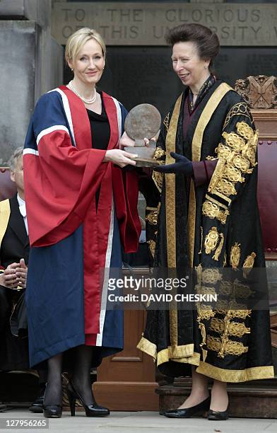 Harry Potter author J.K. Rowling receives a Benefactor's Award from Britain's Princess Anne at an open air ceremony at the University of Edinburgh,...