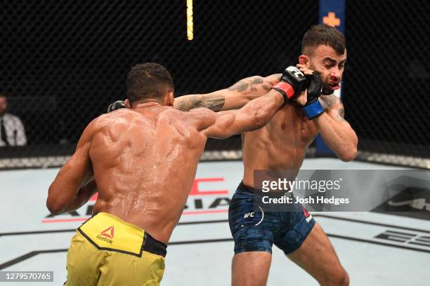 Edson Barboza of Brazil punches Makwan Amirkhani of Finland in their featherweight bout during the UFC Fight Night event inside Flash Forum on UFC...