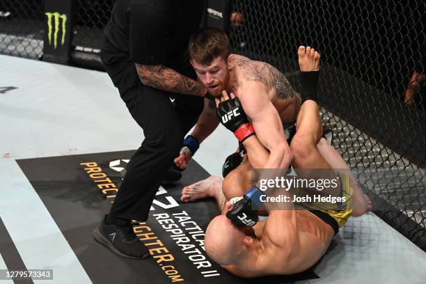 Cory Sandhagen punches Marlon Moraes of Brazil in their bantamweight bout during the UFC Fight Night event inside Flash Forum on UFC Fight Island on...