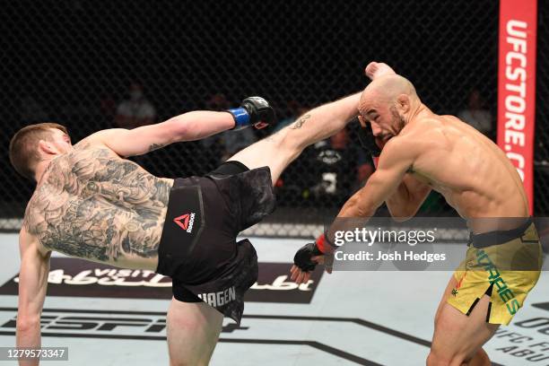 Cory Sandhagen kicks Marlon Moraes of Brazil in their bantamweight bout during the UFC Fight Night event inside Flash Forum on UFC Fight Island on...