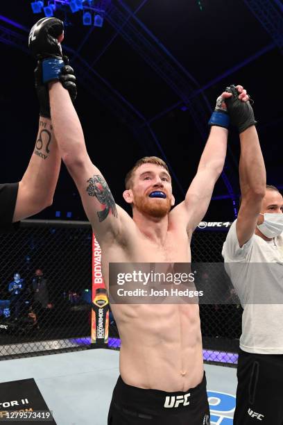 Cory Sandhagen celebrates his victory over Marlon Moraes of Brazil in their bantamweight bout during the UFC Fight Night event inside Flash Forum on...