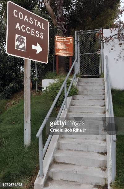 Chain-Link fence, no trespassing and warning signs stating private property greet guests to Broad Beach, April 13, 2002 in Malibu, California.