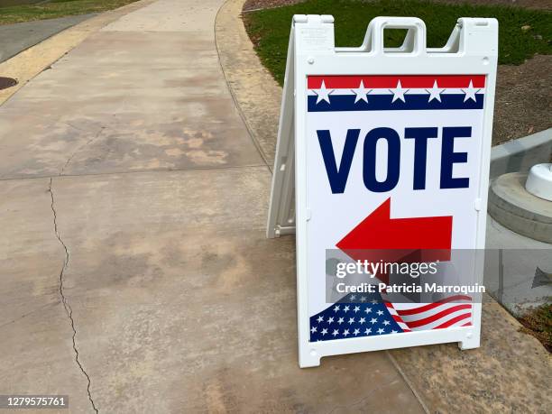 “vote” directional sign - polling place stock pictures, royalty-free photos & images