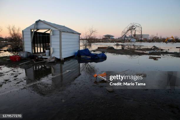 Flood waters from Hurricane Delta surround structures destroyed by Hurricane Laura on October 10, 2020 in Cameron, Louisiana. Hurricane Delta made...