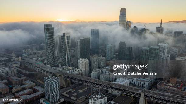 amazing aerial shot of fog rolling over downtown san francisco. - salesforce tower stock pictures, royalty-free photos & images