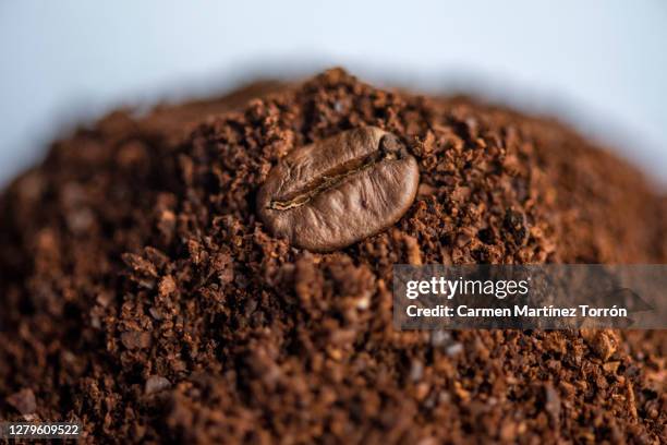 ground and roasted coffee beans. - caffeine powder stock pictures, royalty-free photos & images