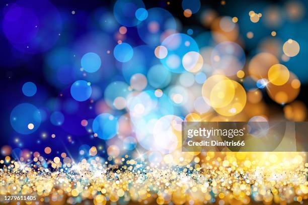 christmas lights defocused background - gold blue bokeh - celebration stock illustrations