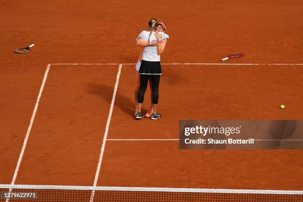 Timea Babos of Hungary and Kristina Mladenovic of France celebrate championship point during their Women's Doubles Final against Desirae Krawczyk of...