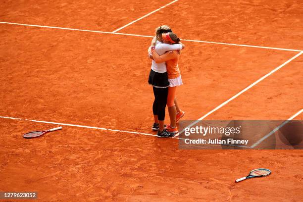 Timea Babos of Hungary and Kristina Mladenovic of France celebrate championship point during their Women's Doubles Final against Desirae Krawczyk of...