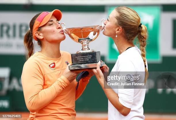 Timea Babos of Hungary and Kristina Mladenovic of France kiss the winners trophy following victory in their Women's Doubles Final against Desirae...