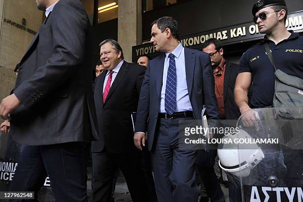 Greek Finance minister Evangelos Venizelos exits the heavy guarded Finance and Economy ministry in Athens after giving a press conference on October...