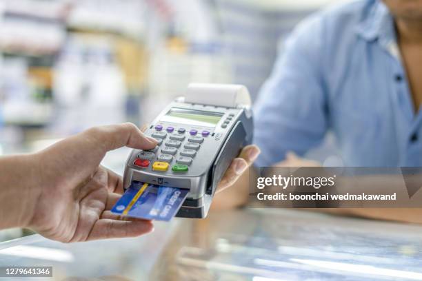 modern payment terminal and credit cards - credit card terminal stock pictures, royalty-free photos & images