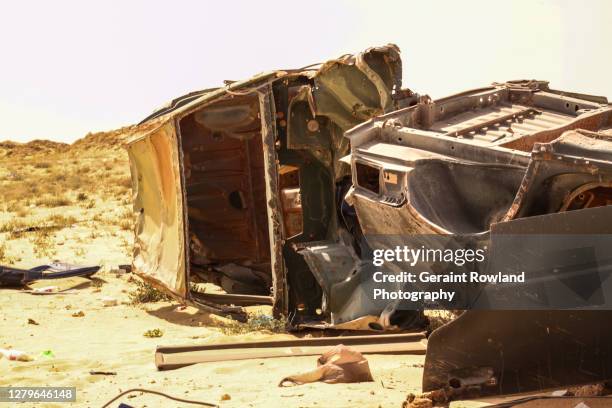 abandoned vehicles in the western sahara. - western sahara conflict stock pictures, royalty-free photos & images