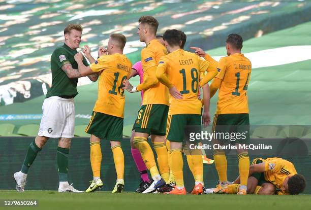 James McClean of Republic of Ireland argues with players from Wales before being shown the red card during the UEFA Nations League group stage match...