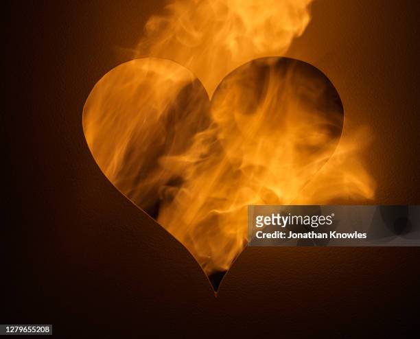 flames burning heart - hearts on fire stock pictures, royalty-free photos & images