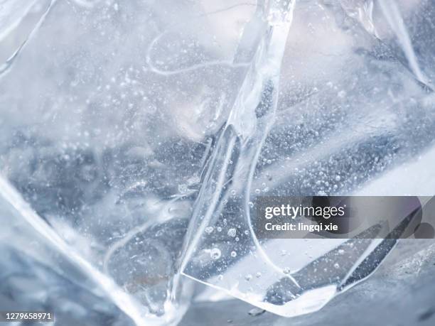 close-up of various forms of ice cubes - translucent glass stock pictures, royalty-free photos & images