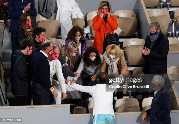 Rafael Nadal of Spain celebrates with his sister Maria Isabel Nadal, wife Maria Francisca Perello and mother Ana Maria Parera following victory in...