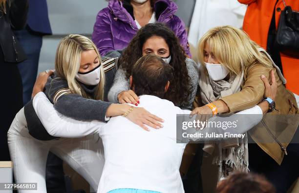 Rafael Nadal of Spain celebrates with his sister Maria Isabel Nadal, wife Maria Francisca Perello and mother Ana Maria Parera following victory in...