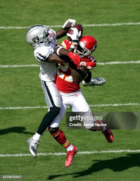 Henry Ruggs III of the Las Vegas Raiders catches a 46-yard pass against Rashad Fenton of the Kansas City Chiefs during the first quarter at Arrowhead...