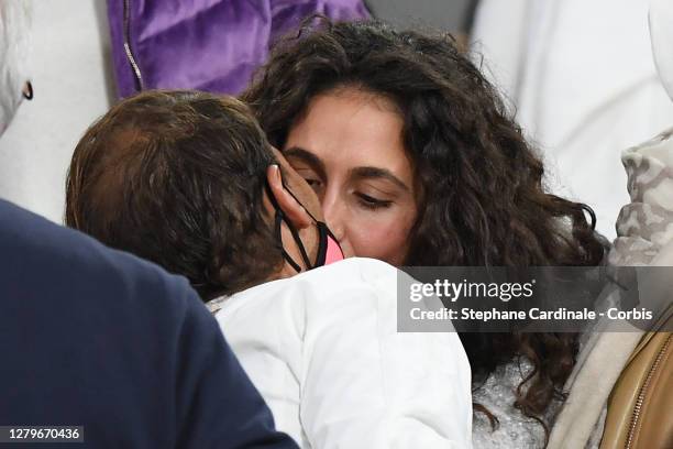 Rafael Nadal of Spain receives a congratulatory kiss from his wife Xisca Perello after his victory against Novak Djokovic of Serbia in the Singles...