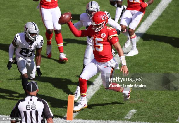 Patrick Mahomes of the Kansas City Chiefs scores a rushing touchdown against the Las Vegas Raiders during the first quarter at Arrowhead Stadium on...