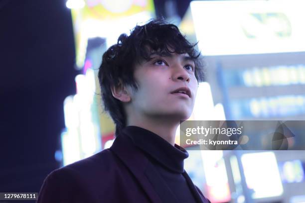 portrait of young asian man in the night - handsome teen boy outdoors stock pictures, royalty-free photos & images