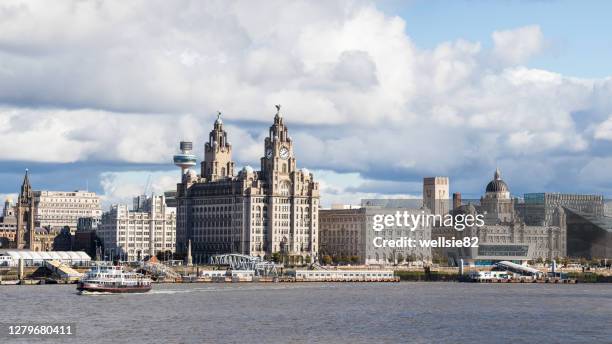 royal iris crossing the river mersey - waterfront stock-fotos und bilder