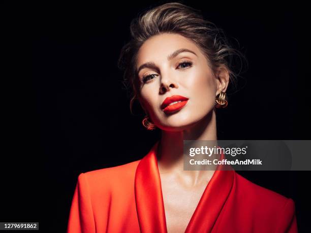 young beautiful woman - red blazer stock pictures, royalty-free photos & images