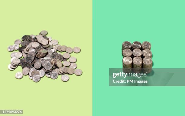 one messy and one neat pile of coins - münzen stock-fotos und bilder
