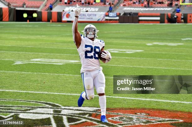 Jonathan Taylor of the Indianapolis Colts celebrates after scoring a touchdown in the first quarter against the Cleveland Browns at FirstEnergy...