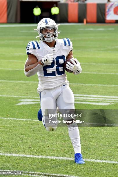 Jonathan Taylor of the Indianapolis Colts scores a touchdown in the first quarter against the Cleveland Browns at FirstEnergy Stadium on October 11,...