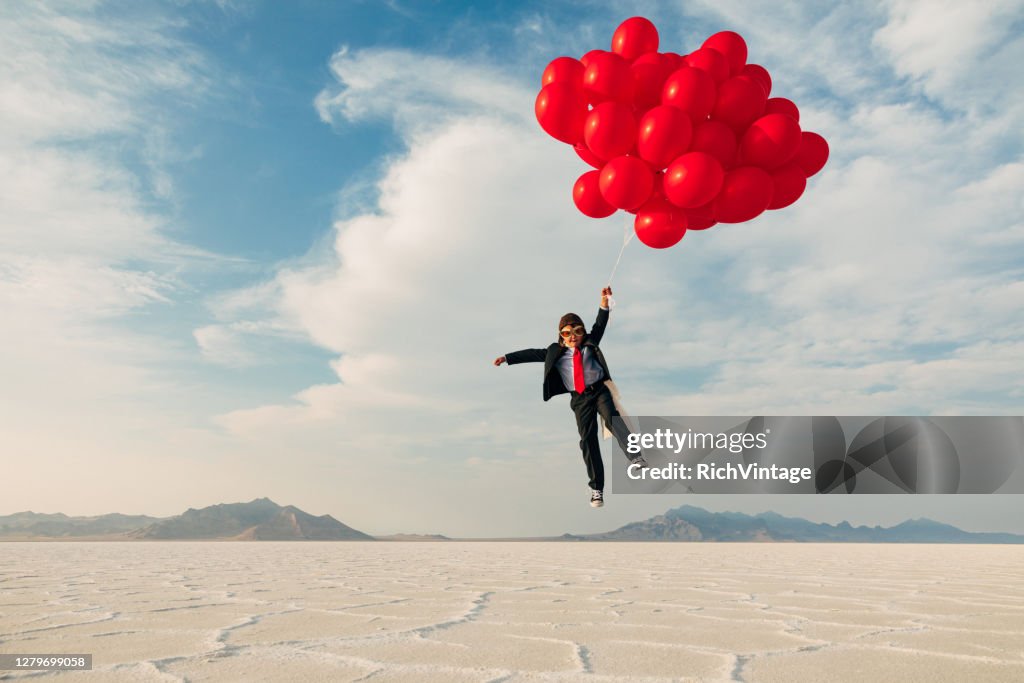 Young Business Boy with Balloons